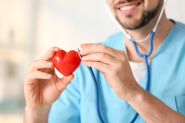 Closeup of a doctor holding a heart