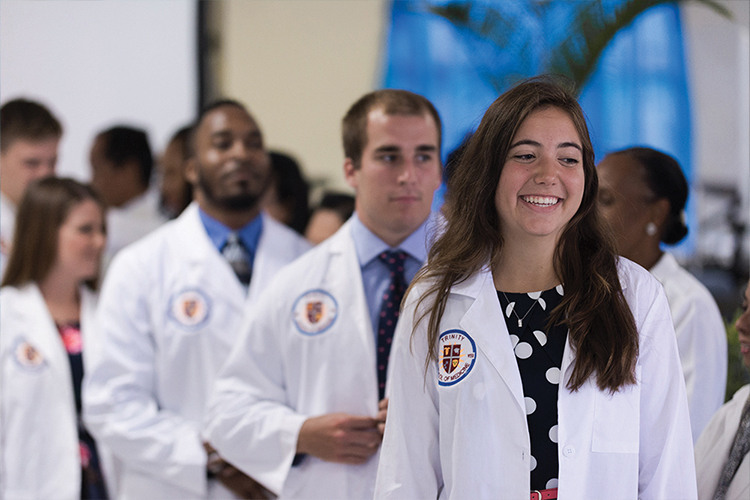 Caribbean medical school students standing in line at the White Coat Ceremony