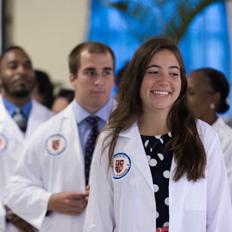 Caribbean medical school students standing in line at the White Coat Ceremony